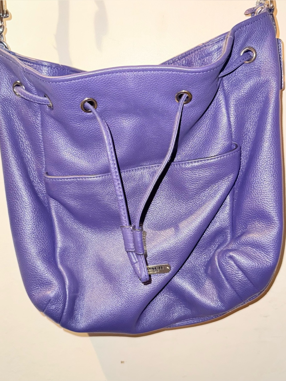 COACH purple pebbled bucket drawsting purse with slouchy silhouette.